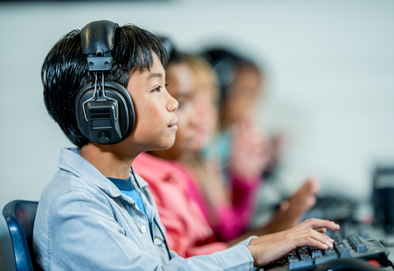 Elementary students working on computers