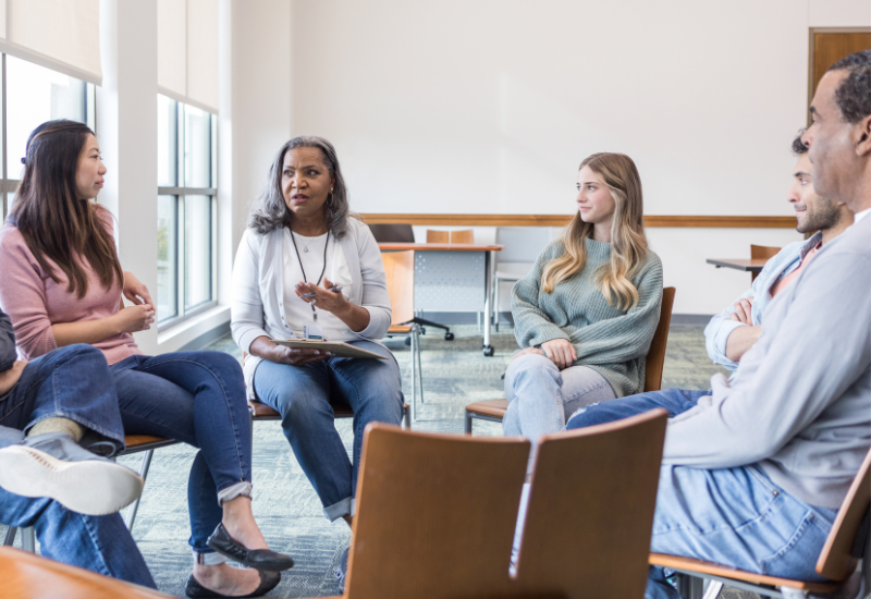Discussion group sits in circle