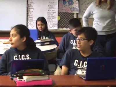 Photo of students and teacher in classroom

