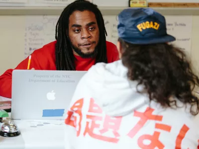 Teacher talks directly with student
